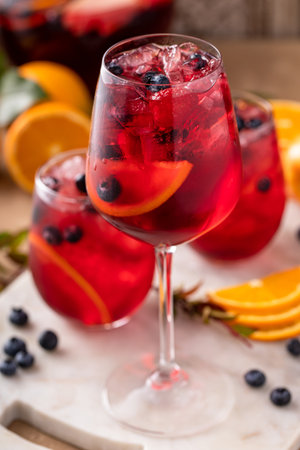 Refreshing summer berry sangria with apples, oranges and blueberryの写真素材