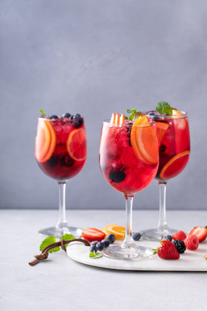 Refreshing summer berry sangria with red wine, apples and orangesの写真素材
