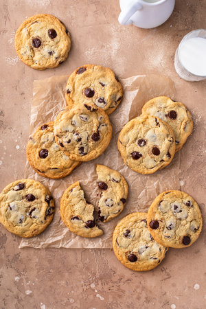 Chocolate chip cookies with flaky salt on parchment paper, homemade freshly baked cookiesの写真素材