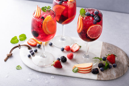 Refreshing summer berry sangria with red wine, apples and orangesの写真素材