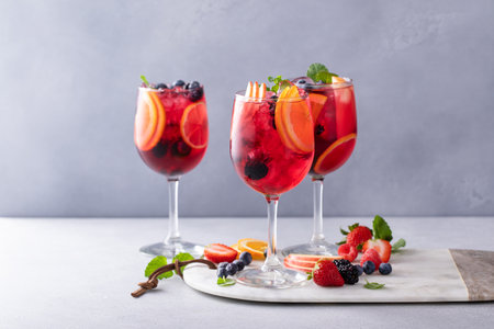 Refreshing summer berry sangria with red wine, apples and orangesの写真素材