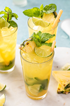 Pineapple mojito with limes and mint and a slice of pineappleの写真素材