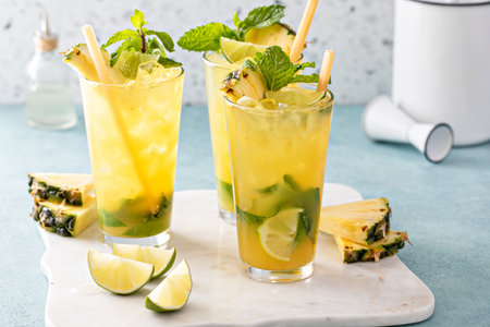 Pineapple mojito with limes and mint and a slice of pineappleの写真素材