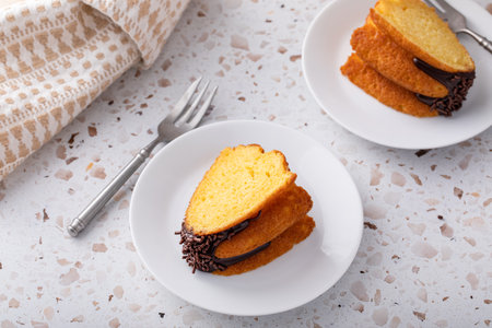 Orange pound bundt cake with dark chocolate ganache and chocolate sprinkles