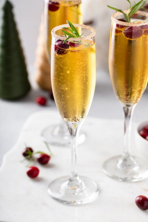 Apple cider mimosa cocktail with cranberries for Christmas or Thanksgivingの写真素材