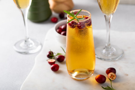 Apple cider mimosa cocktail with cranberries for Christmas or Thanksgivingの写真素材