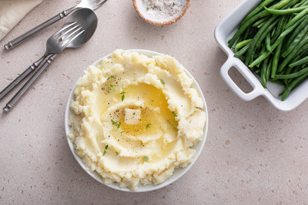 Mashed potatoes in a serving bowl, traditional side dish for every day dinner or celebrationの写真素材
