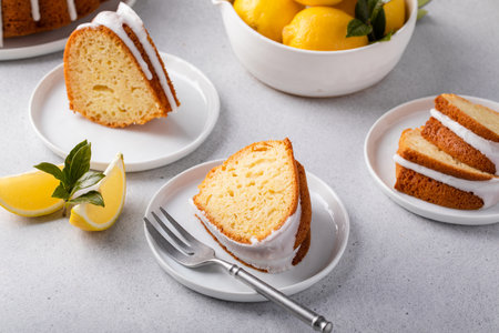 Lemon bundt cake with sugar powder vanilla icing on a cake standの写真素材