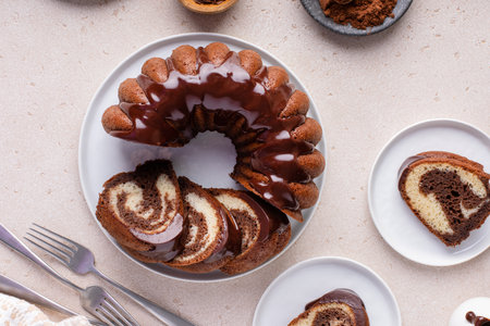 Marbled bundt cake sliced on a plate, chocolate and vanilla cakeの写真素材
