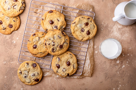 Chocolate chip cookies freshly baked on parchment paperの写真素材