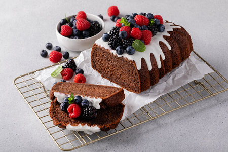 Lemon bundt cake on a cake stand with powdered sugar glaze dripsの写真素材
