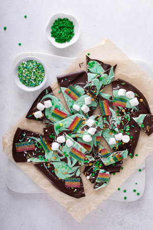 Fun chocolate bark for Saint Patricks day with green chocolate, rainbow candy and sprinklesの写真素材