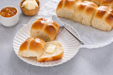 Hot cross buns served with butter and orange marmalade, recipe for Easter brunch or breakfastの写真素材