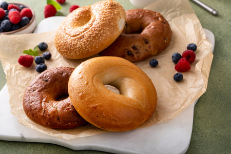 Freshly baked bagels ready to eat for breakfast, sesame, cinnamon and plain bagelsの写真素材