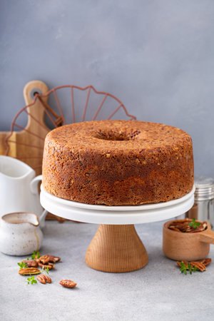 Pecan caramel pound cake baked in a bundt pan, homemade and served on a cake standの写真素材