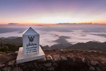 Beautiful Sunrise of travel place with morning mist at Phu chi duen Unseen in Chiangrai,Thailandの写真素材