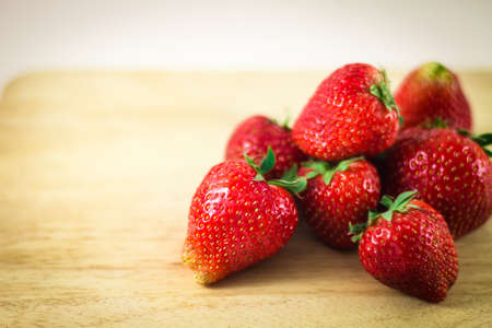 Strawberry isolated on white background and wooden floors.の写真素材