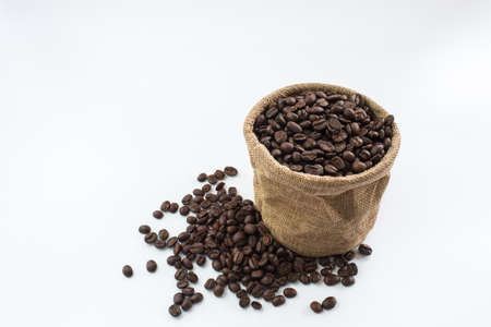 Coffee beans and coffee bags, isolated on white backgroundの写真素材
