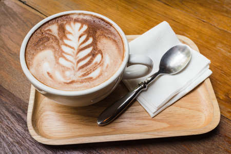 Cup of coffee with beautiful artの写真素材