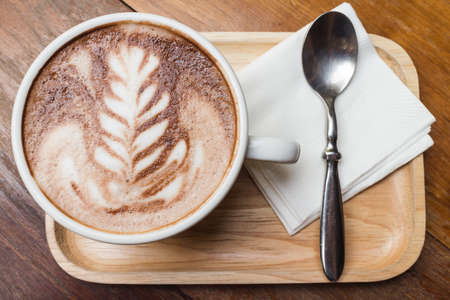 Cup of coffee with beautiful artの写真素材