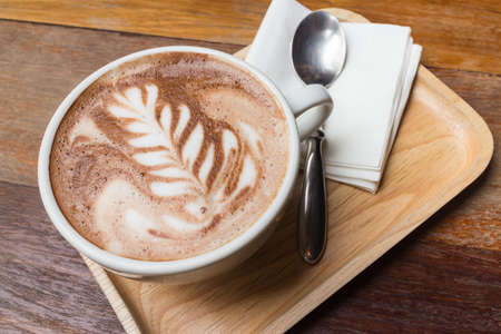 Cup of coffee with beautiful artの写真素材