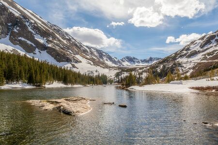 Panoramic springtime view of Blue Lakes in Colorado with clouds and blue skies