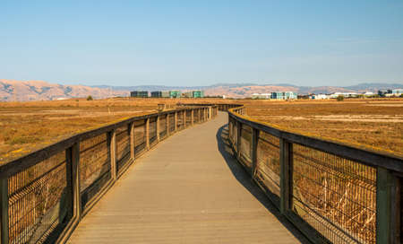 A boardwalk at Baylands Nature Preserve. Palo Alto, Santa Clara County, California, USAの写真素材