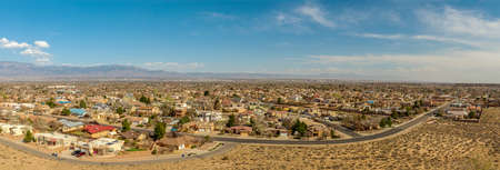 Southwest living. Albuquerque Metro Area Residential Panorama with the view of the Sandia Mountains in the distance. Petroglyph National Monument, New Mexicoの写真素材