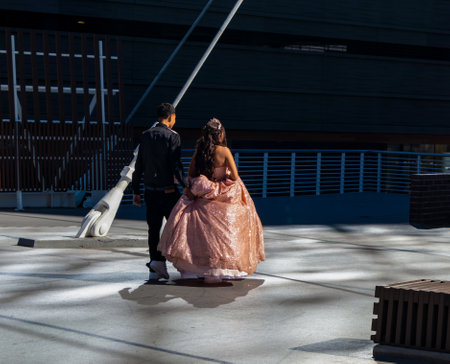 Denver, Colorado - October 16, 2021: Young couple celebrating  on Millennium Bridge in downtown Denver, Coloradoの写真素材