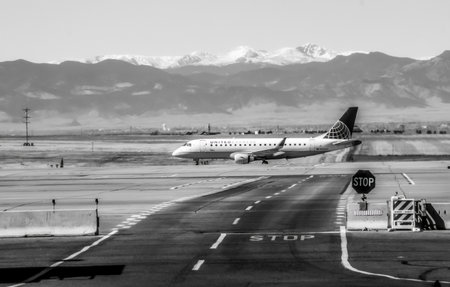 Denver, Colorado - October 29, 2021: Embraer E175LR operated by United Express taxis at Denver International Airport, Coloradoのeditorial素材