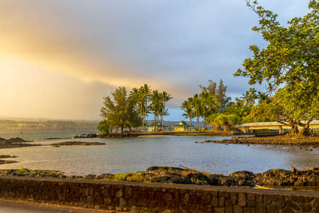 Beautiful Liliuokalani Park and Gardens in Hilo, Hawaii, on a rainy sunsetの写真素材