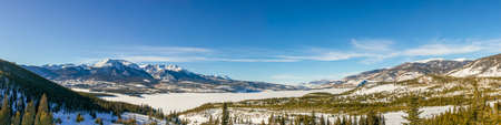 Beautiful winter landscape with evergreen trees and ski tracks in the Rocky Mountains, Colorado, near lake Dillonの写真素材