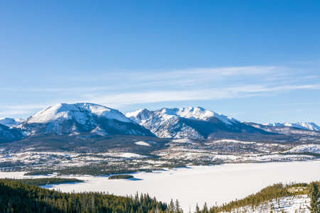 Beautiful winter landscape with evergreen trees and ski tracks in the Rocky Mountains, Colorado, near lake Dillonの写真素材
