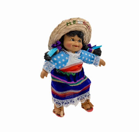 Female doll in colorful traditional clothes of Mexican people on a white backgroundの写真素材