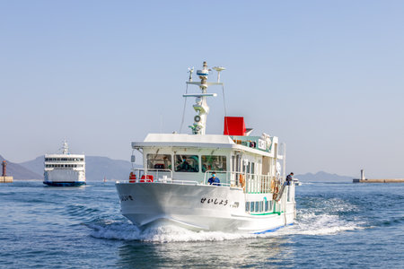 Takamatsu, Japan - March 29, 2023: Ferry boat crossing the Seto Inland Sea from Takamatsu to Naoshima Islandのeditorial素材