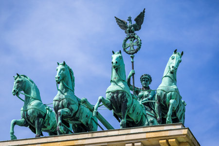 Berlin, Germany - May 31, 2023: The bronze sculpture Quadriga on top of the Brandenburg Gate in Berlin, Germanyのeditorial素材