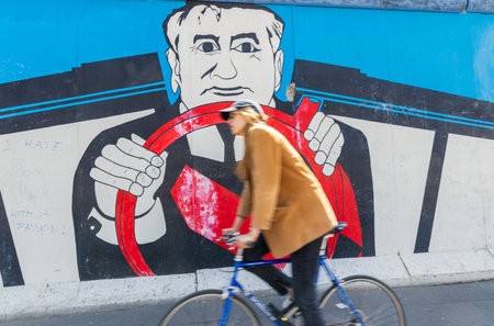 Berlin, Germany - June 1, 2023: Tourists visiting free public urban art of East Side Gallery on a public street in Berlin, Germanyのeditorial素材