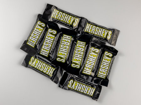 Denver, Colorado - December 13, 2023: Milk chocolate candy bars on a white background.