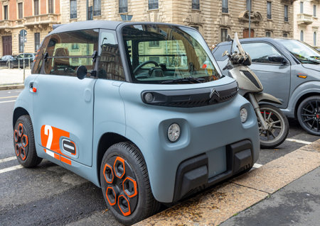Milan, Italy - February 25, 2024: Small Citroen Ami Electric Two-Seater Micro-City Car Parked in The Street of Milan, Italyのeditorial素材