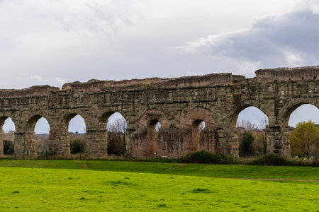 Park of the Aqueducts (Parco degli Acquedotti), an archeological public park in Rome, Italy, part of the Appian Way Regional Park, with monumental ruins of Roman aqueducts.の写真素材