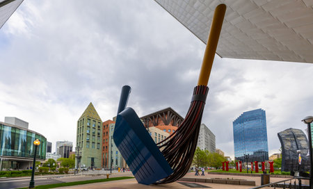 Denver, Colorado - May 14, 2024: Denver's modern skyline with the sculptures in the foreground seen from the Denver Art Museum on a cloudy dayのeditorial素材