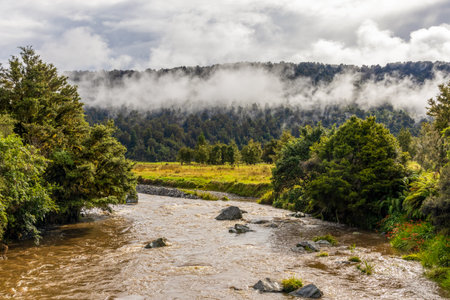 Scenic Landscape on Clearwater River, Lake Matheson, and Walkaway Trail in Fox Glacier, South Island, New Zealandの写真素材