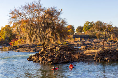 Columbus, Georgia - November 14, 2025: Scenic Woodruff Riverfront Park and Historic Riverfront Industrial District in Columbus, Georgia, at sunsetのeditorial素材