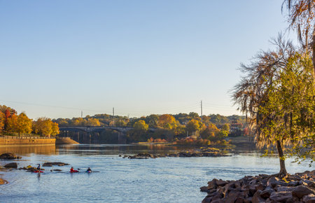 Columbus, Georgia - November 14, 2025: Scenic Woodruff Riverfront Park and Historic Riverfront Industrial District in Columbus, Georgia, at sunsetのeditorial素材