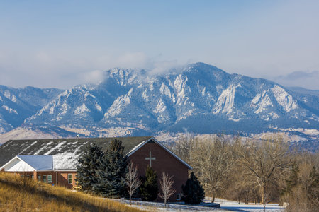 Colorado Living. Lafayette, Colorado - Denver Metro Area Residential Winter Panorama and a church with the view of the Front Range mountains in the distanceの写真素材