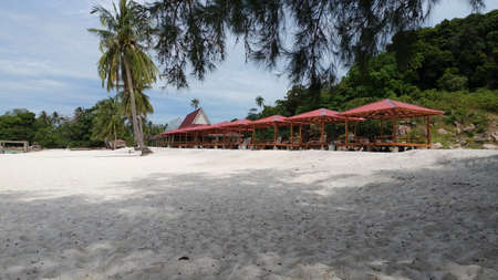 a row of huts by the beachの写真素材