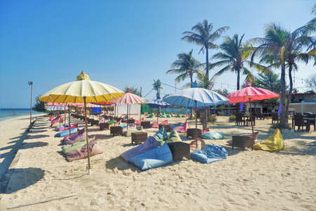 LOMBOK, INDONESIA - OCT 23, 2020: Bean bags and Parasols for beach visitors and guests in front of Aston Sunset Beach Resort, Gili Trawangan, Lombokのeditorial素材