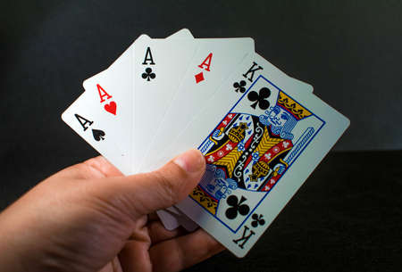 Playing cards in a black backgroundの写真素材