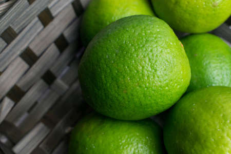 Group of limes in a wooden backgroundの写真素材