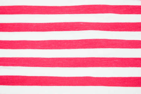 Red colored lines of a textile material as cottonの写真素材
